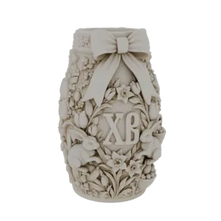 Modello 3D di un barattolo pasquale con coniglietti, fiori e monogramma 'XB', con un fiocco decorativo in cima.