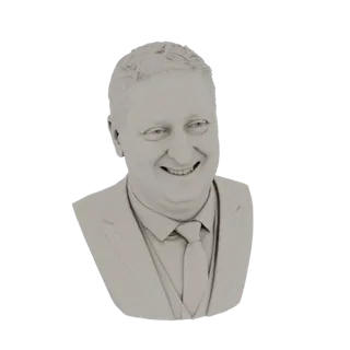 A 3D render of a light gray bust of a smiling man wearing a suit and tie.