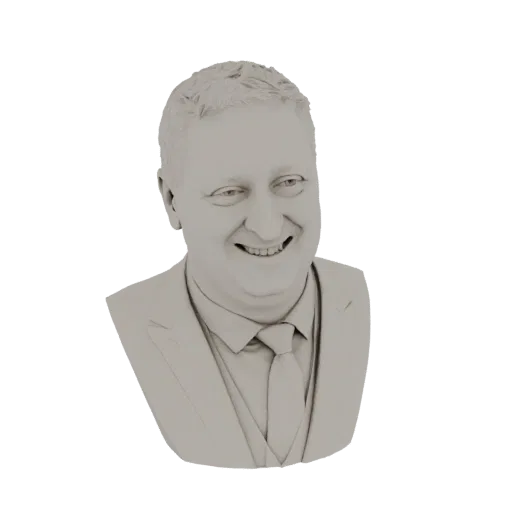A 3D render of a light gray bust of a smiling man wearing a suit and tie.