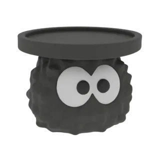 3D-Modell-Rendering eines schwarzen Rußmännchens mit großen weißen Augen, das eine flache schwarze runde Plattform hält.