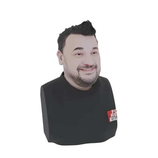 A 3D render of a stylized bust of a smiling man with spiky black hair and a black t-shirt, presented on a white background.