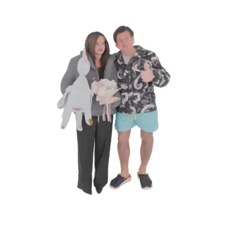 3D model of a couple embracing, the woman holds a unicorn plush, the man holds flowers and gives a thumbs-up.