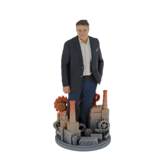 3D model of a man in a suit standing in front of a miniature factory with gears and smokestacks.