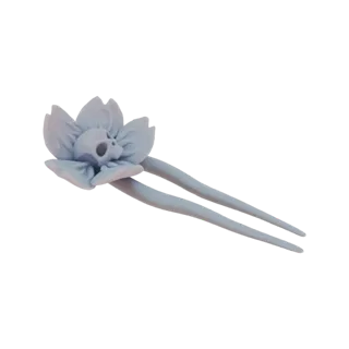 Un rendering 3D di un fermaglio per capelli gotico con un teschio all'interno di un fiore di loto, presentato in una finitura