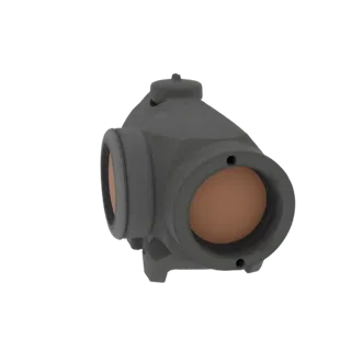 3D model of a compact red dot sight with a matte gray finish and amber-tinted lenses, shown from a side angle.