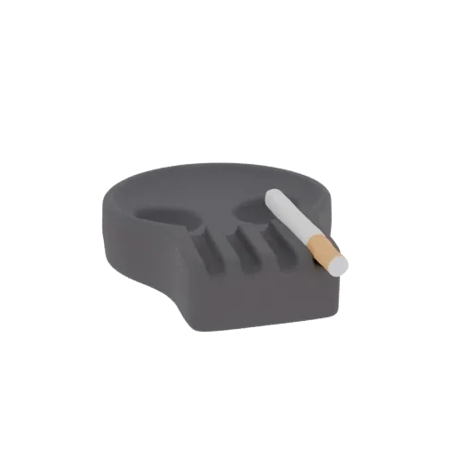 3D-Render eines dunkelgrauen, totenkopf-förmigen Aschenbechers mit einer Zigarette am Rand, isoliert auf weißem Hintergrund.
