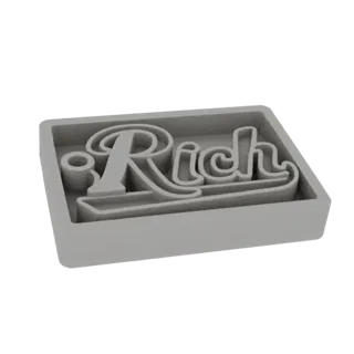 3D render of a gray cookie cutter with the word 'Rich' in a stylized script font.