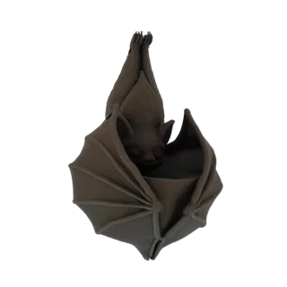 A dark, stylized 3D model of a bat sleeping while hanging upside down, with its wings wrapped around its body.