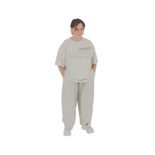 3D model of a young person wearing an oversized graphic t-shirt and baggy pants, standing with hands in pockets.