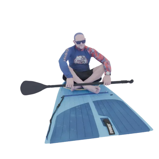 3D model of a man sitting cross-legged on a blue paddleboard, holding a black paddle, wearing sunglasses and a rash guard.