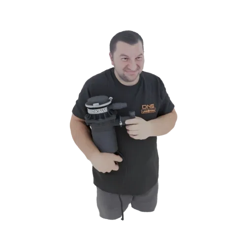 3D model of a man in a black t-shirt holding a black air filter, smiling at the viewer.