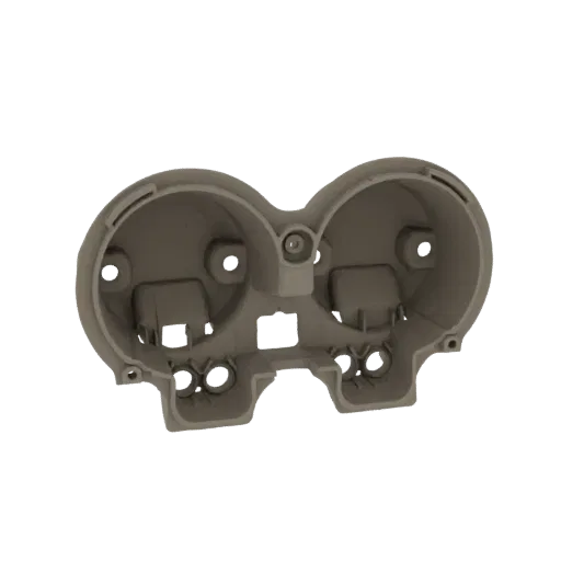 3D model of a dual gauge cluster housing with two circular openings for gauges and mounting features.