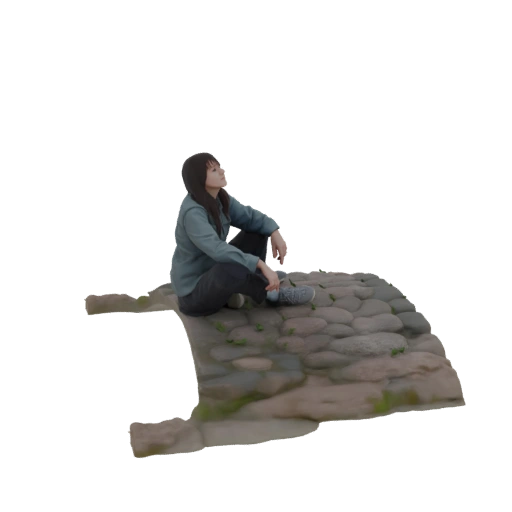 Woman Sitting on Cobblestone Path