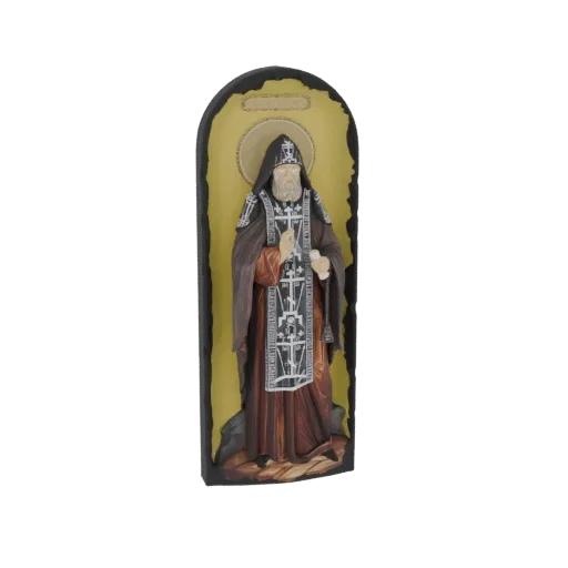 3D model of an Orthodox monk in traditional robes, holding a staff and scroll, with a halo against a golden background.