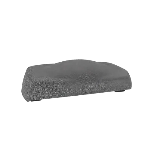 Un modèle 3D de repose-poignet ergonomique texturé gris avec un profil incurvé, vu de côté.