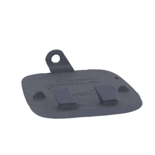 3D model of a dark gray car bumper tow hook cover with a visible mounting tab and clip features, presented against a white ba