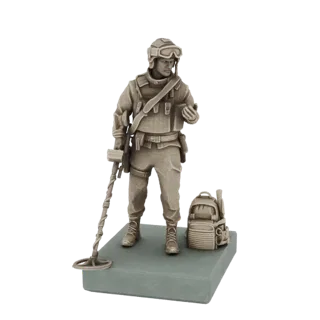 3D model of a modern soldier holding a metal detector, with a backpack to the side, standing on a base.