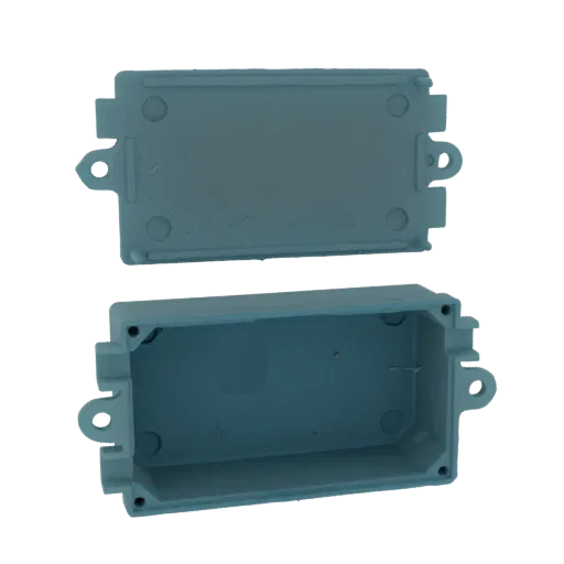 3D model of a gray rectangular junction box with its lid, shown separately.