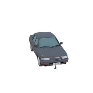 A 3D model of a classic dark gray sedan, viewed from a slight top-down angle, against a plain background.