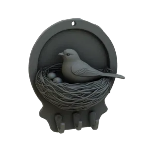 3D-Modell eines dekorativen Wandhakens mit einem Vogel in einem Nest mit drei Eiern und drei Haken darunter.