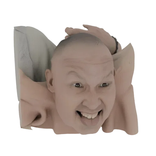3D model of a man's bald head with a wide, manic grin, tongue sticking out, and hands behind his head, against a white backgr