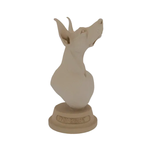 3D model of a Doberman dog bust with head tilted up, on a base inscribed 'THE BEST', rendered in a light, neutral material.