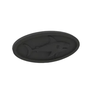 Render del modello 3D di un ciondolo ovale scuro con un design di squalo in rilievo al centro.