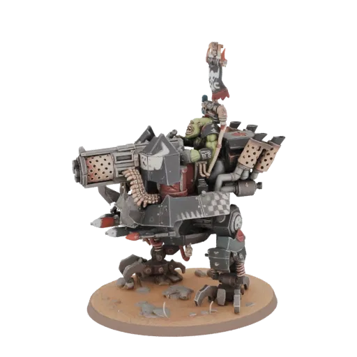 3D model of an Ork Mega Dread, a large, heavily armed green-skinned alien war machine on a sandy base.