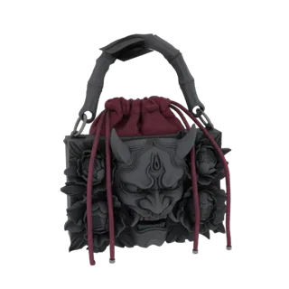 3D model of a grey handbag featuring a carved Oni mask and peony flowers, with a dark red drawstring closure and bamboo-style