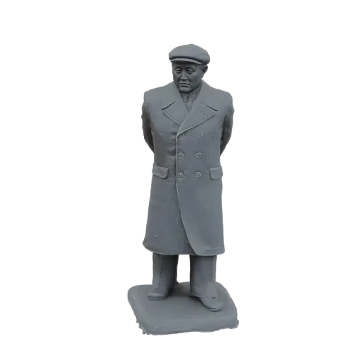 3D model of a gray statue of a man wearing a long coat and a flat cap, standing with hands behind his back on a base.