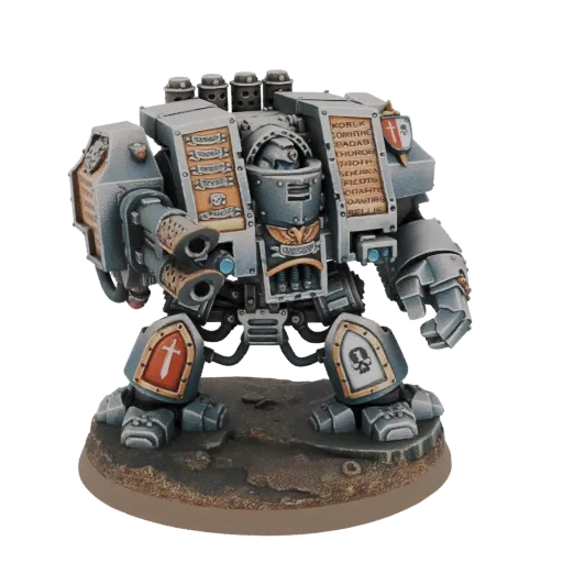 A detailed 3D model of a Grey Knights Dreadnought, a large, heavily armored robotic walker, standing on a textured base.