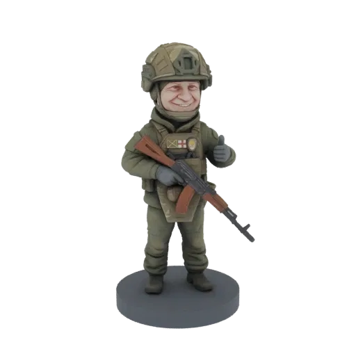 3D model of a soldier in green tactical gear, holding an AK-47 rifle and giving a thumbs-up, standing on a grey base.