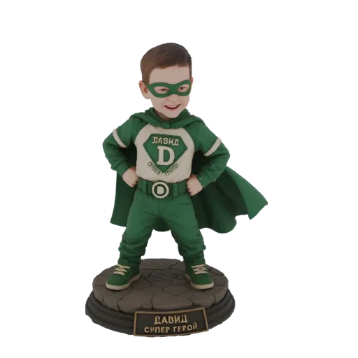 3D model of a young boy dressed as a superhero in a green costume with a 'D' emblem and a cape, standing on a stone base.