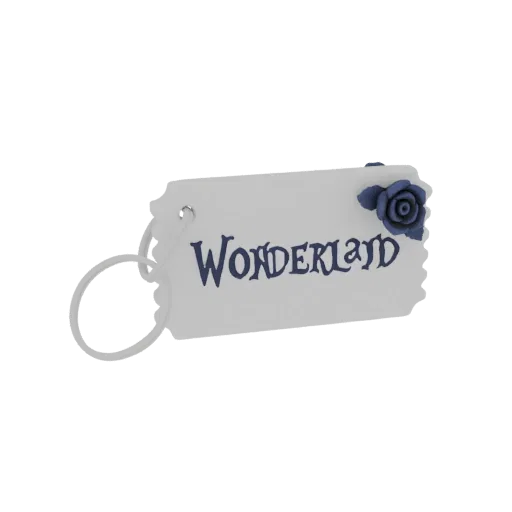 3D model of a white 'Wonderland' tag with a dark blue rose charm and a white loop attached.