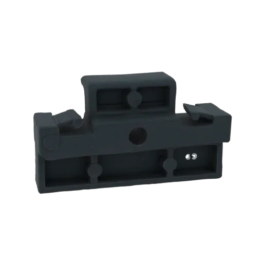 3D model of a dark gray connector bracket with interlocking tabs and mounting holes, presented against a white background.