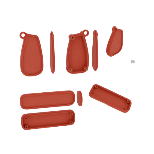 Uma coleção de modelos 3D em forma oval vermelha, alguns com furos de parafuso visíveis, dispostos sobre um fundo branco.