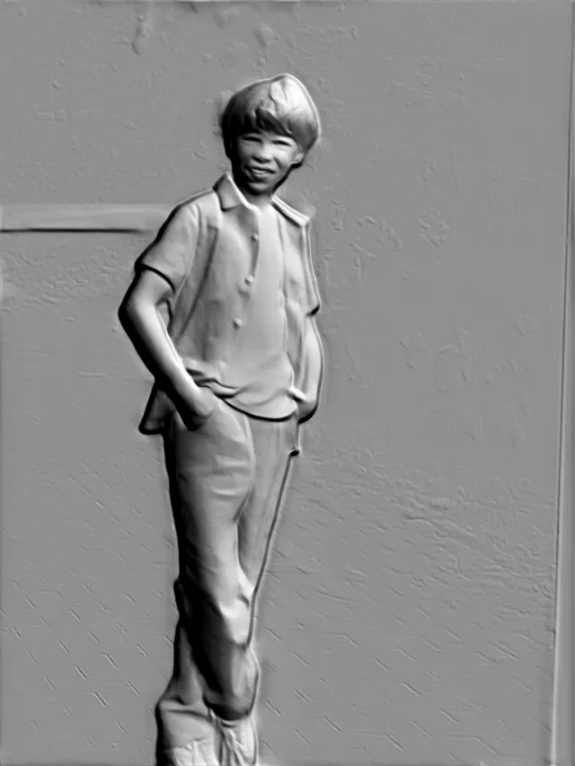 3D model of a boy in shirt and pants bas-relief, standing in a relaxed pose with hands in pockets.