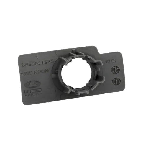 3D model of a grey plastic automotive part bracket with embossed text and a central circular mounting hole.