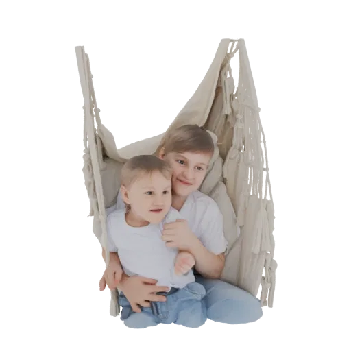 3D model of two young boys, one older, hugging each other while sitting in a beige woven hammock.