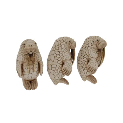 Three intricately carved walrus figurines displayed in a row, showcasing detailed textures and naturalistic poses.