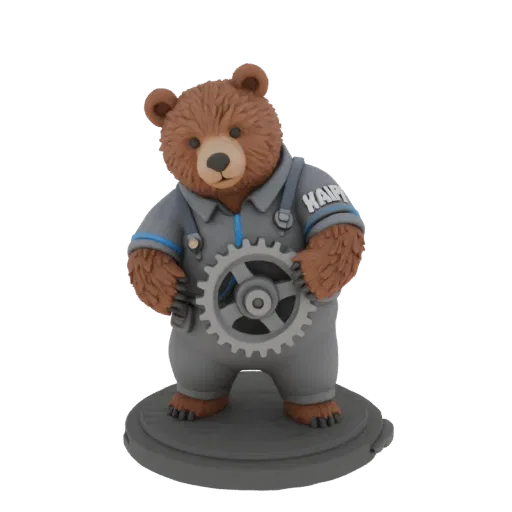 3D model of a brown bear in a grey work uniform, standing on a base and holding a large gear. "KADVI" inscription on the back