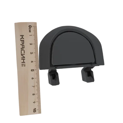 3D model of a dark gray D-shaped handle with two mounting brackets, shown next to a ruler for scale.