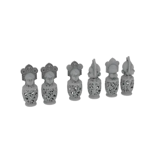 A collection of six ornate, intricately carved busts displayed against a black background.