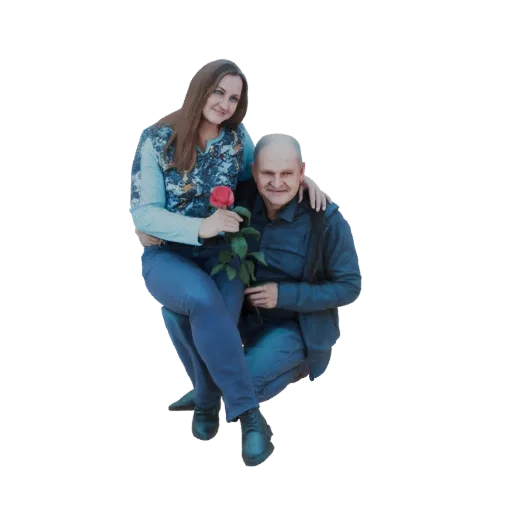 3D model of a man kneeling and embracing a woman who is seated, holding a red rose between them.