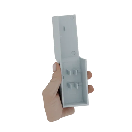 A hand holding a light gray plastic wall mount bracket with internal clips, showcasing its design for mounting.