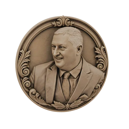 3D model of a circular bronze medallion featuring a relief portrait of a smiling man in a suit, surrounded by decorative scro