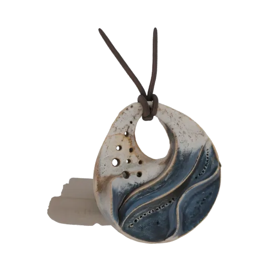 3D model of an organic ceramic pendant with a blue wave design and a brown leather cord, set against a white background.