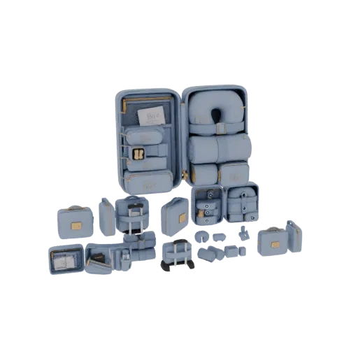 3D model of a luxury travel set with an open suitcase filled with packing cubes, toiletry bags, and a neck pillow, all in pas