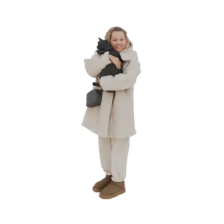 Modelo 3D de mulher sorrindo em casaco de inverno creme e botas marrons, segurando um gato preto.