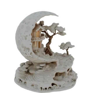 3D model of a fantasy diorama featuring a house built into a crescent moon, with rocky terrain and stylized trees.